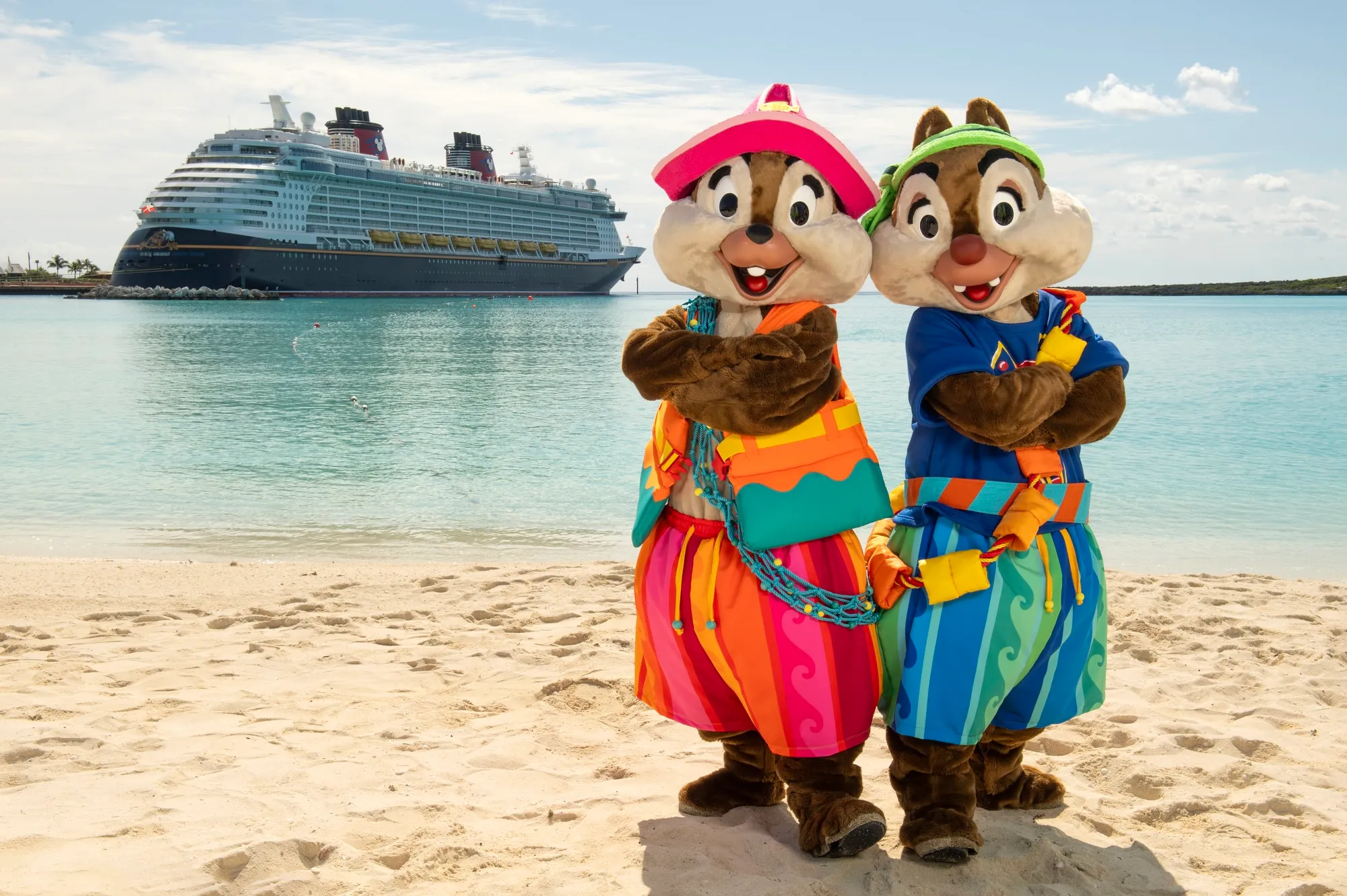two people in clothing on a beach