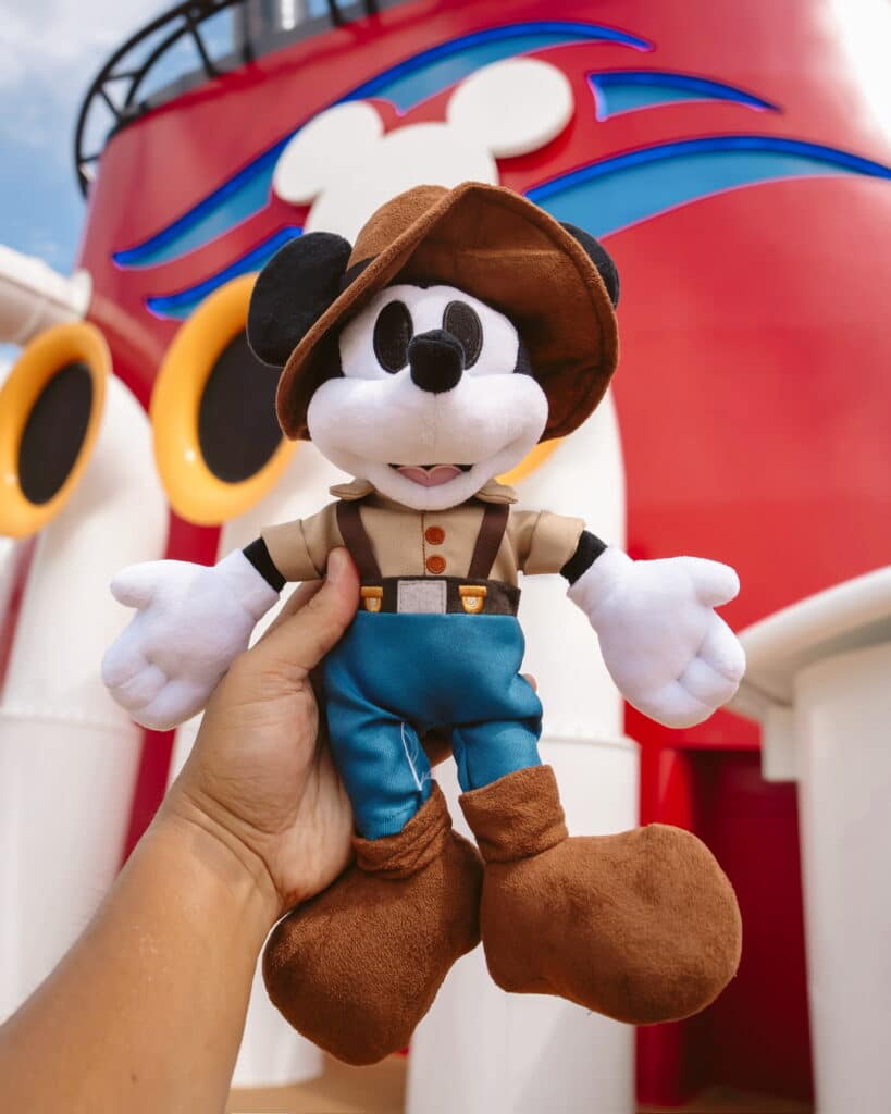 a hand holding a stuffed toy